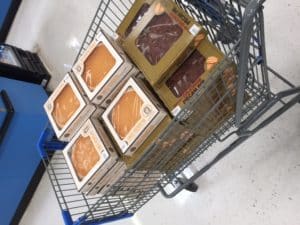 Walmart cart filled with sweet potato pie and pecan pie