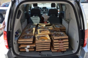 Trunk of van filled with pies