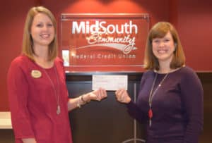 Melissa Topping presents a donation check to United Way of Central Georgia