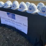 Hardhats on table for Consultants & Builders, Inc.