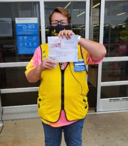 Sandra with Walmart holding Visa gift card from MidSouth FCU